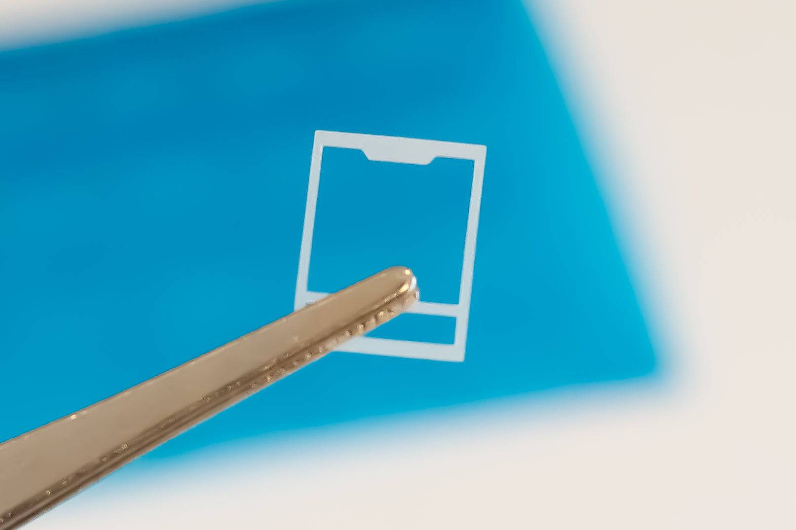 A single Durock switch film made with HTV and Polycarbonate. It's 0.15mm thick and perfect for changing the acoustics of MX styled mechanical key switches.