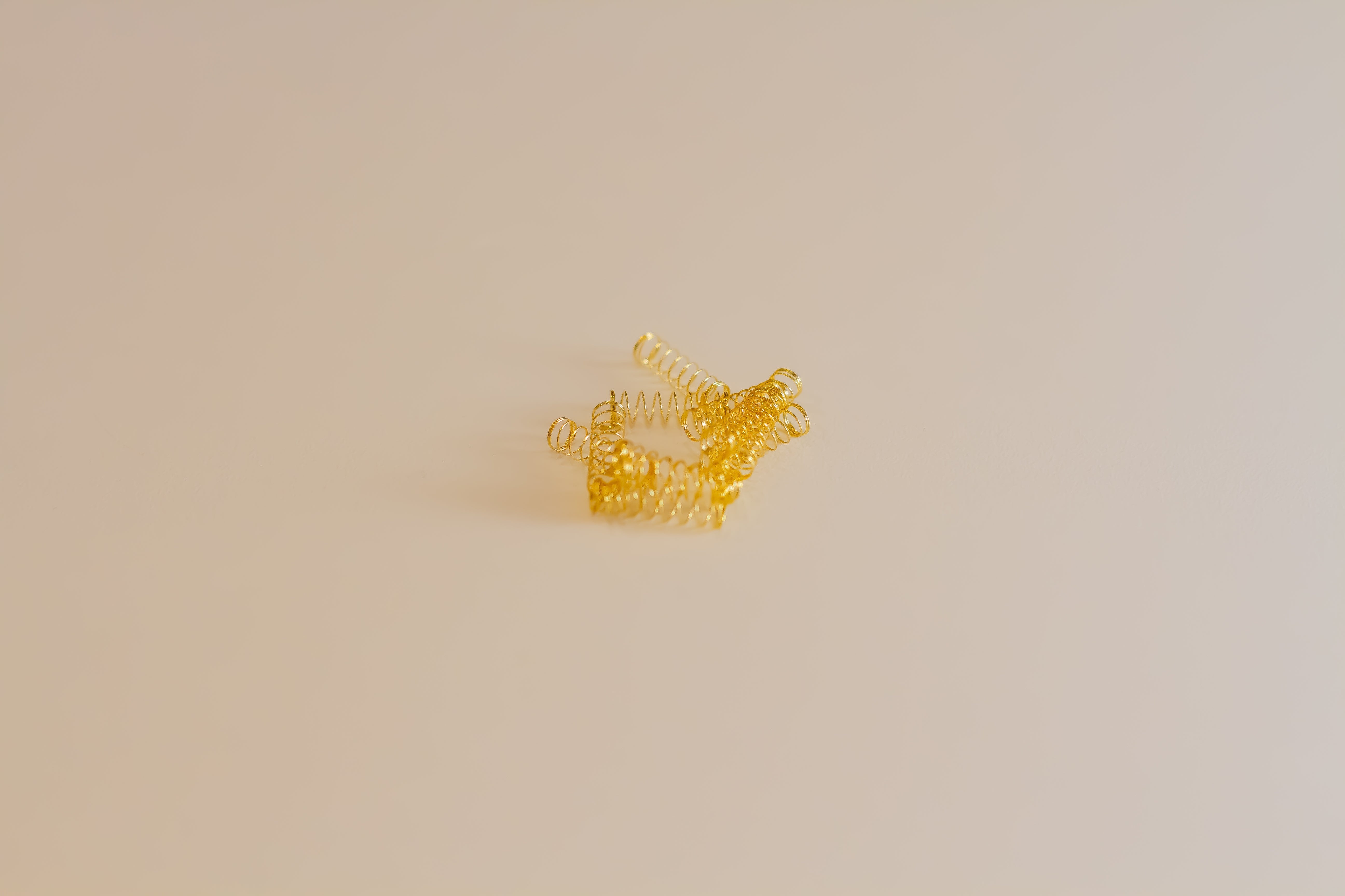 A clump of Durock gold plated mechanical switch springs.