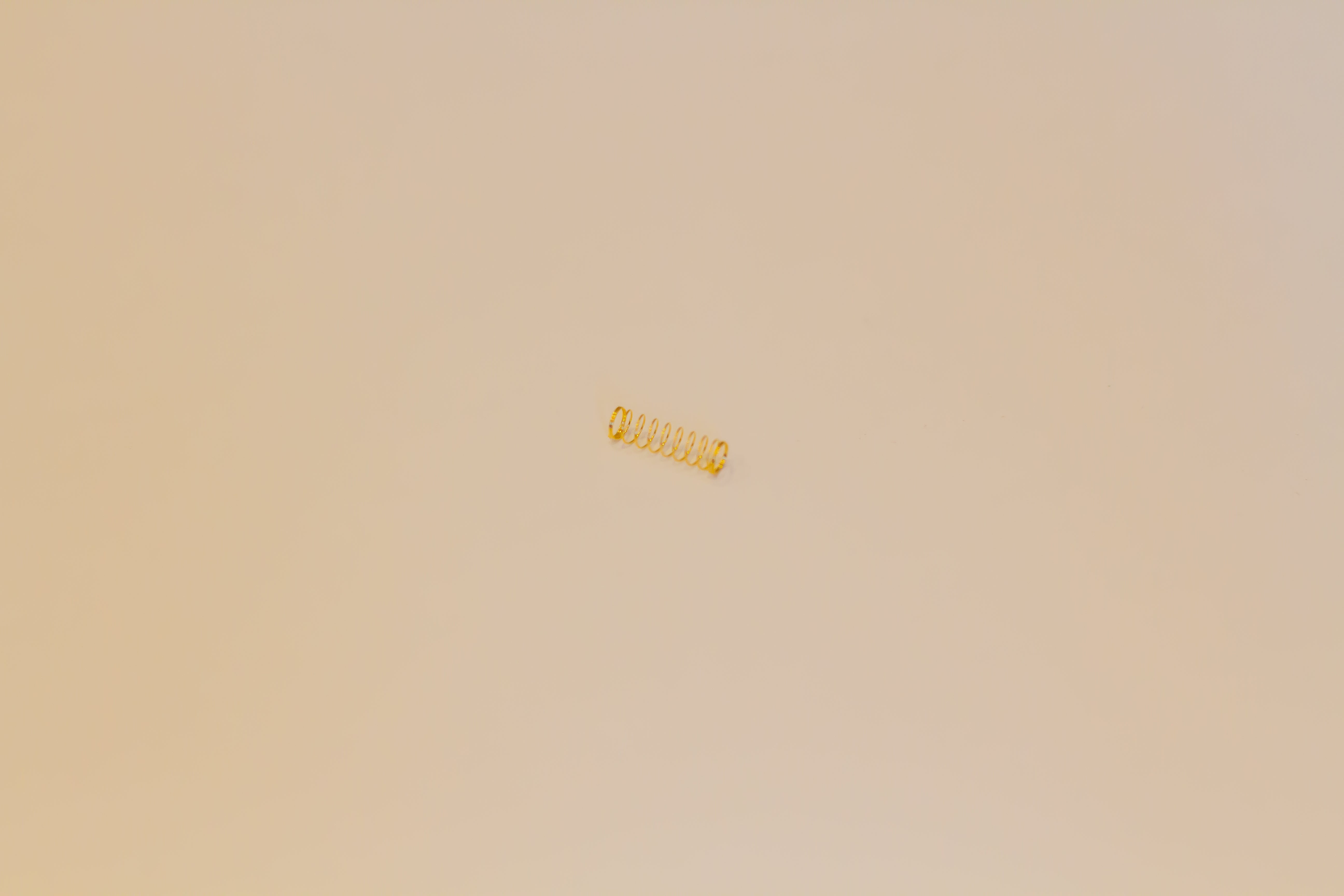 A single Durock gold plated mechanical switch spring.