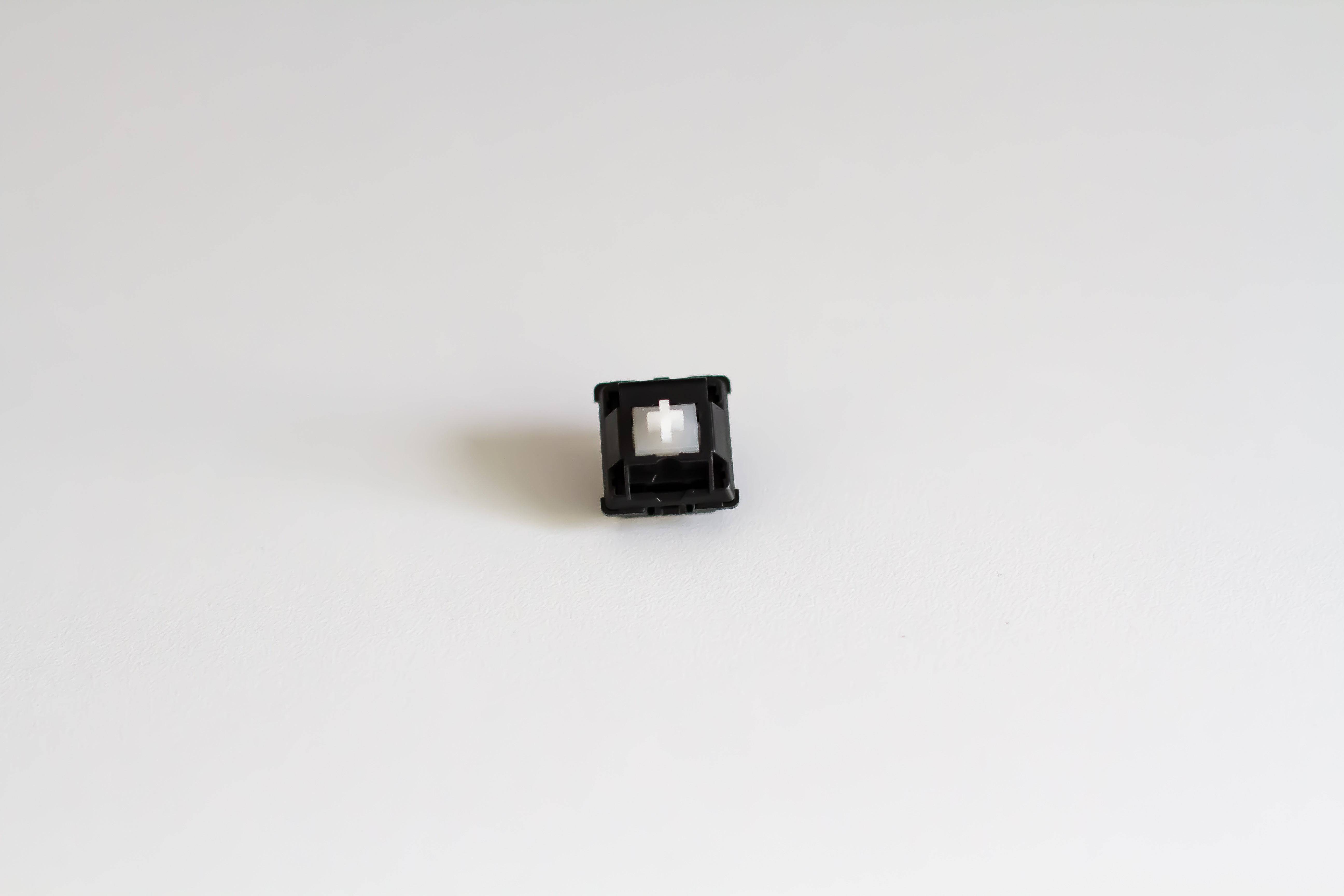 A single Durock POM linear mechanical keyboard switch.