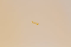 A single Durock gold plated mechanical switch spring.