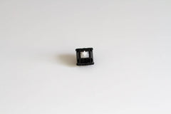 A single Durock POM linear mechanical keyboard switch.