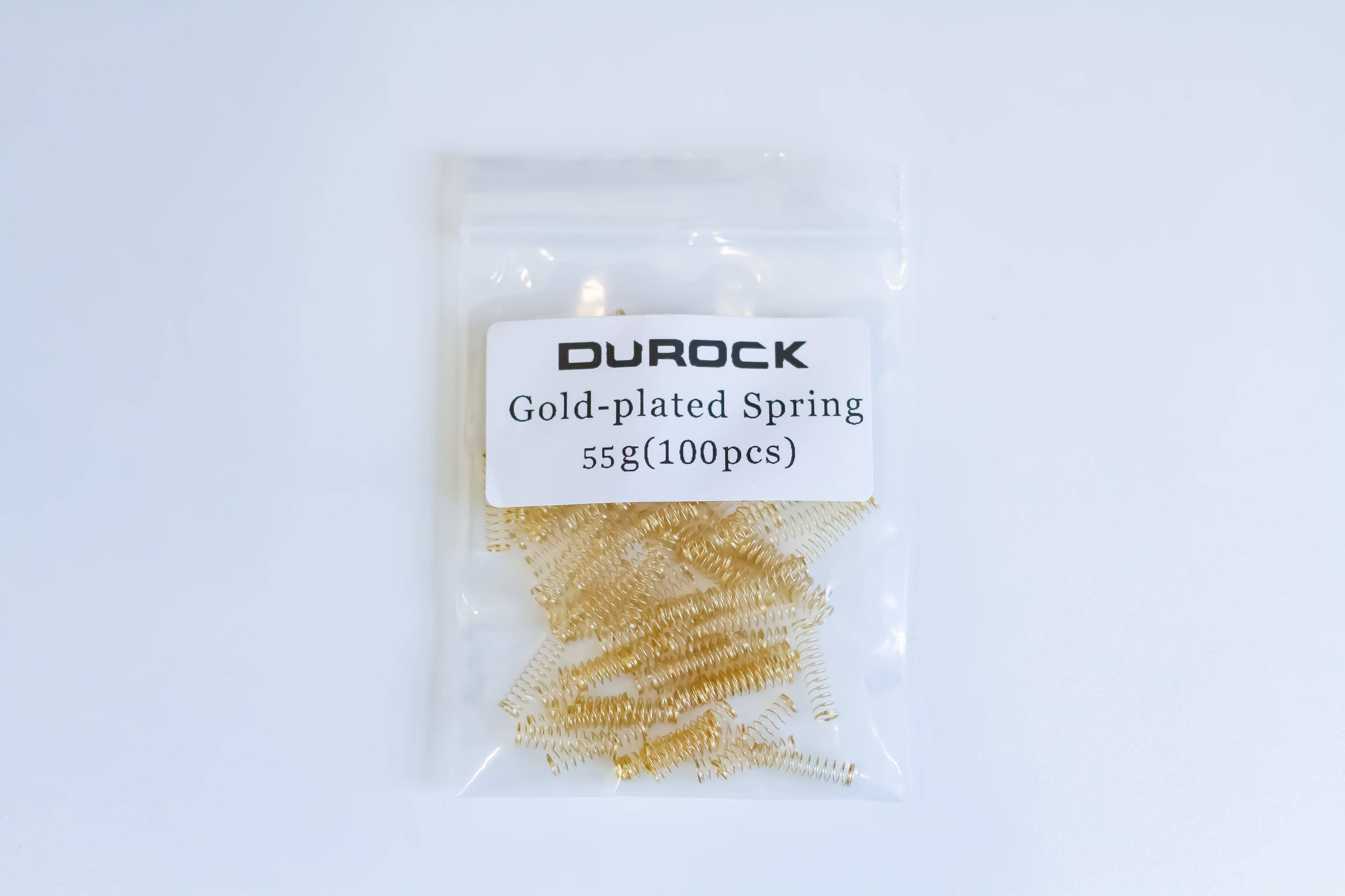 A Pack of one hundred gold plated Durock mechanical switch springs with 55 grams bottom out weight.