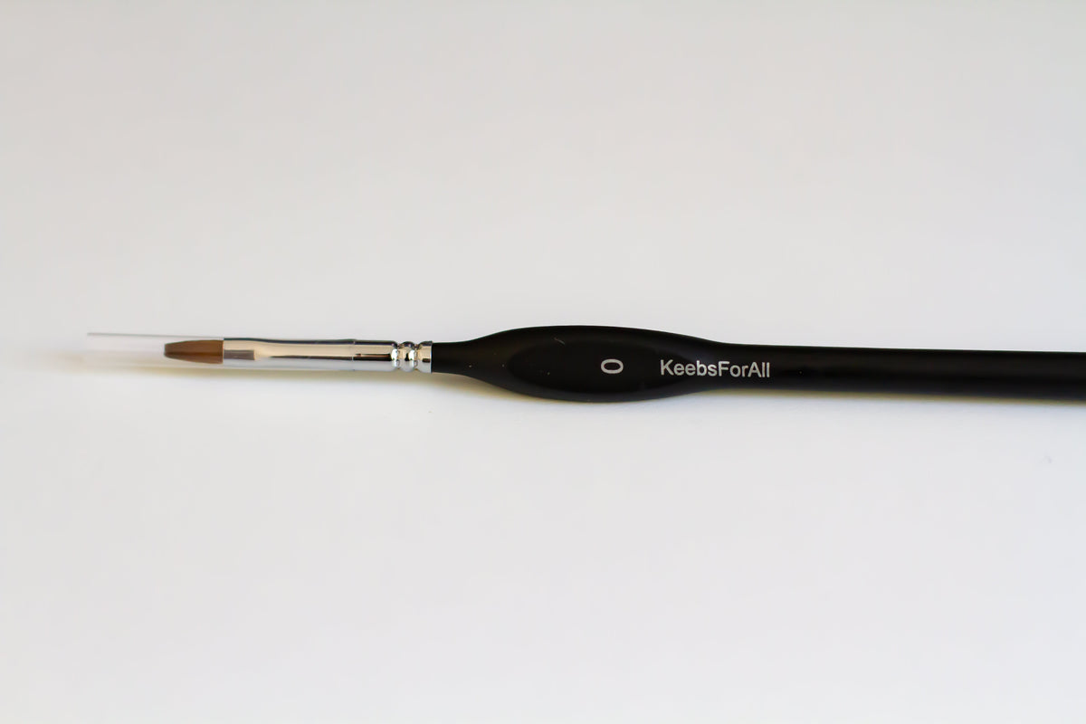 A single flathead KeebsForAll mechanical keyboard switch lube brush in size zero.