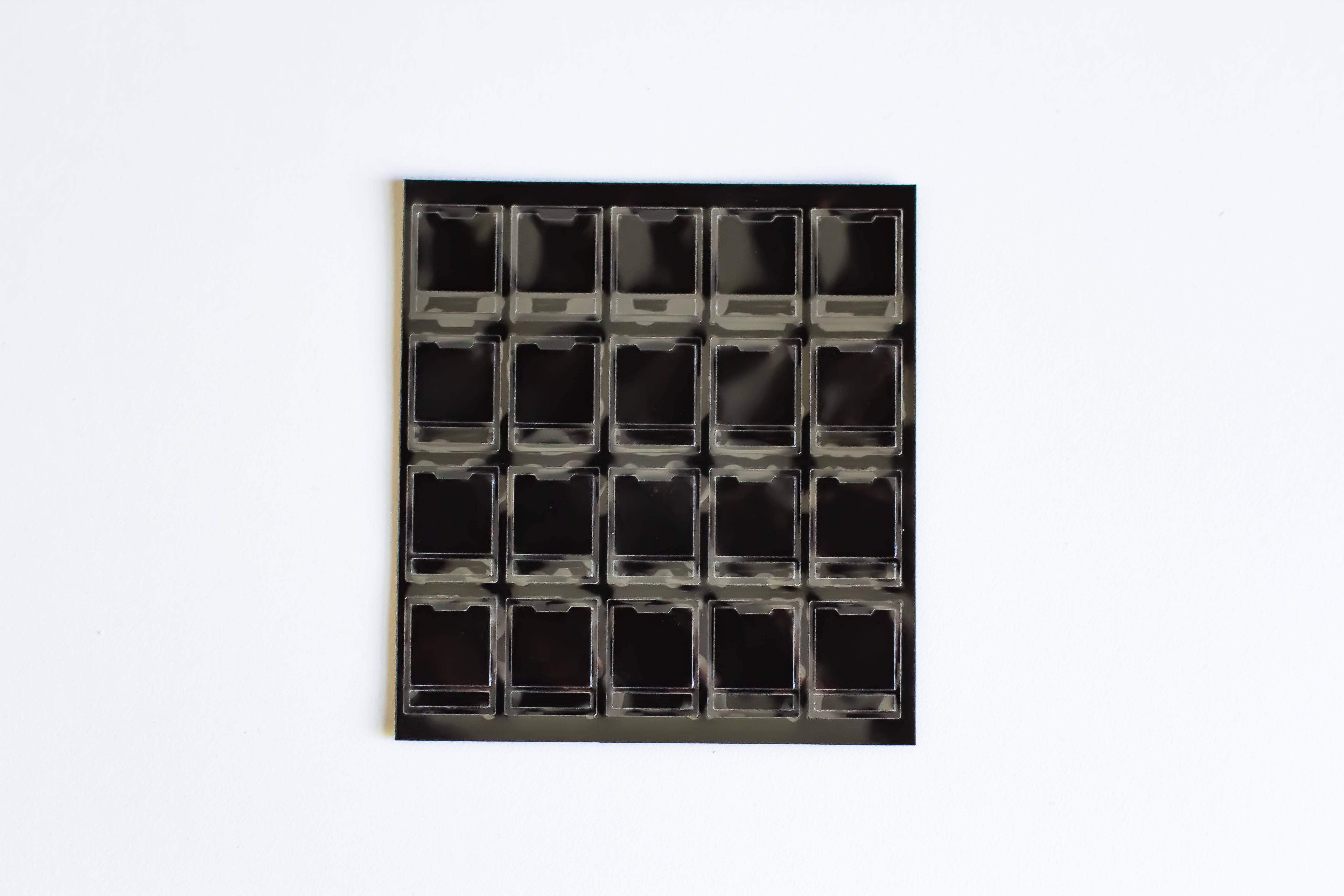 A single sheet of Deskeys mechanical keyboard switch films.